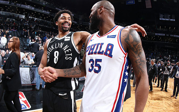 Spencer Dinwiddie shaking hands with former teammate Trevor Booker 750x469