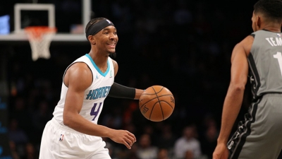 Charlotte Hornets guard, Devonte’ Graham, on left with the ball, while Brooklyn Nets guard Garrett Temple defends. Wednesday, December 11, 2019, at the Barclays Center in Brooklyn.