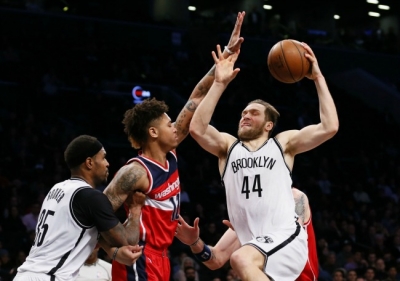 Bojan Bogdanovic, Brooklyn Nets guard, going to basket against Washington Wizards guard, Kelly Oubre Jr.