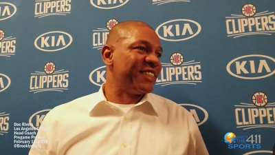 Doc Rivers talking with reporters at the Barclays Center in Brooklyn prior to a game with the Brooklyn Nets