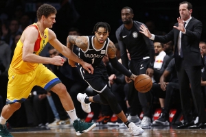 Brooklyn Nets guard D’Angelo Russell pushing past Milwaukee Bucks center, Brook Lopez on Monday, April 1, 2019, at the Barclays Center. The Brooklyn Nets lost to the Milwaukee Bucks 131-121.  