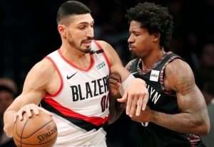 Ed Davis, Brooklyn Nets center (right), defending against Portland Trail Blazers center Enes Kanter  