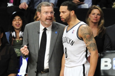 Brooklyn Nets interim head coach PJ Carlesimo (l) talking with Nets point guard Deron Williams