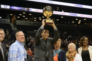 Francis Lewis High School Girls Basketball Head Coach, Stephen Tsai, hoisting PSAL AA Divison Girls Basketball Championship trophy