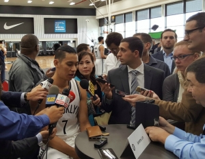 Brooklyn Nets guard Jeremy Lin talking with reporters.