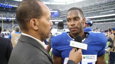 Andrew Rosario talking with New York Giants wide receiver Victor Cruz